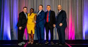 Document Solutions staff accepting IPMA award